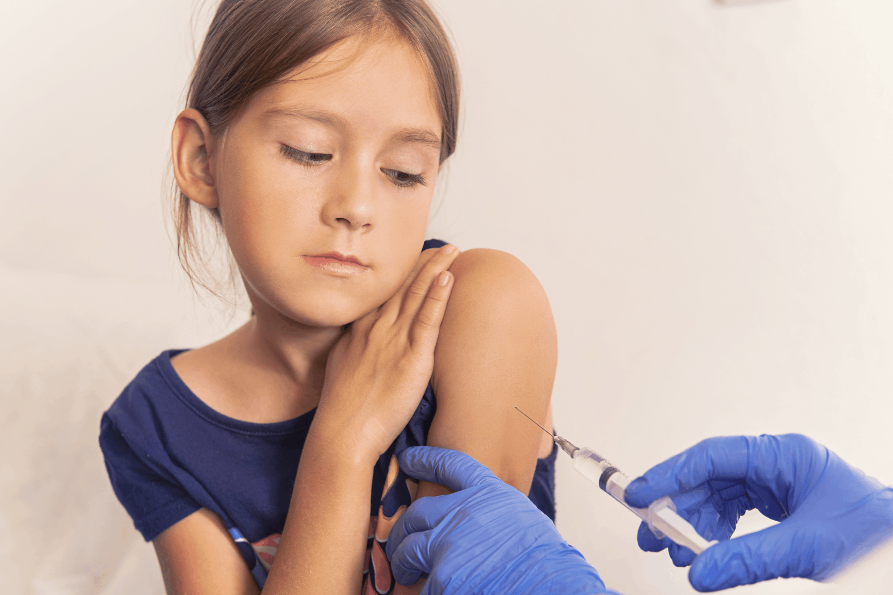 the girl is given a vaccine